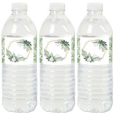 three plastic water bottles with labels on the front and back of them, each containing different types of leaves