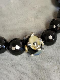 Spiritual Black Beads Jewelry, Spiritual Black Beads Round Jewelry, Adjustable Black Beaded Round Bracelet, Adjustable Round Black Beaded Bracelet, Round Beaded Hematite Jewelry, Adjustable Czech Glass Gemstone Beads, Black Hematite Faceted Beaded Bracelets, Evil Eye Bracelet With Round Gemstone Beads, Evil Eye Bracelet With Gemstone Beads As Gift