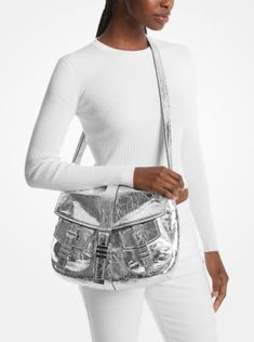 Our Darrington shoulder bag will make an extra-special addition to your handbag collection. Crafted from metallic crushed leather for a textured look, it features a fold-over design and patch pockets with buckle-fastening details. There’s enough space within the lined interior for your cosmetics bag, wallet, and even a tablet. Handbag Collection, Cosmetics Bag, Michael Kors Collection, Colby, Leather Silver, Metallic Leather, How To Take Photos, Patch Pocket, Leather Shoulder Bag