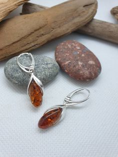 Baltic Amber and sterling silver 925. Very elegant earrings. Cognac colour. With hallmark. Length about 3,5 cm https://www.etsy.com/shop/AmberLithuania?ref=simple-shop-header-name&listing_id=780205095&section_id=27948198 Mother Wedding, Baltic Amber Jewelry, Brown Earrings, Multicolor Earrings, Amber Earrings, Amber Beads, Gift For Mother, Wedding Jewellery, Amber Jewelry