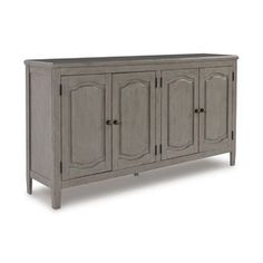 the sideboard has four doors and three drawers