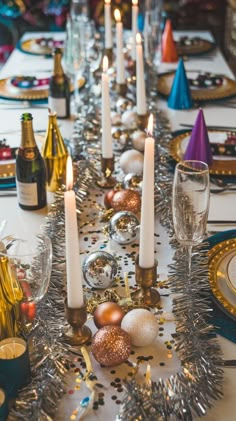 the table is set with candles and decorations