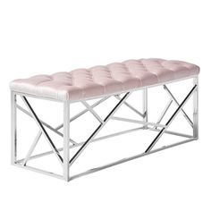 a white bench with a pink seat cushion on it's back and chrome legs