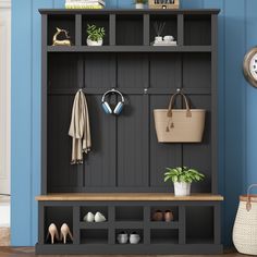 a coat rack with shoes and bags on it in front of a blue painted wall