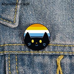 a black cat with yellow eyes is in the pocket of a jean jacket that has an orange, white and blue stripe on it