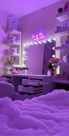 a bedroom with purple lighting and white fur on the bed in front of a mirror