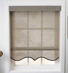 a window with a roman blind in it