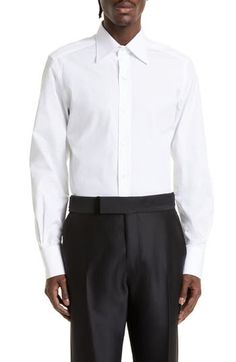 Standout details like tulip-edge mitered cuffs and mother-of-pearl buttons put Tom Ford's stamp on this Italian-made poplin shirt tailored in a slim fit. 33" length; 44" chest (size 44) French placket Cutaway collar Mitered, two-button cuffs 100% cotton Machine wash, line dry Made in Italy Designer Clothing Designer Business Shirt With Button Cuffs, Formal Cotton Shirt With Covered Buttons, Formal Shirt With Cuffed Sleeves And Fold Down Collar, Designer Formal Shirt With Button Cuffs, Designer Formal Shirt With Button Closure, Formal Spring Shirt With Cuff, Designer Collared Dress Shirt For Formal Occasions, Formal Spring Shirt With Cuffs, Designer Formal Collared Dress Shirt