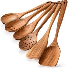 six wooden spoons lined up next to each other