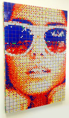 a painting made out of legos with the image of a woman's face