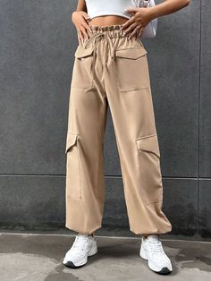 Stay comfortable and stylish with these Elastic Knot Detail Pants with Pocket. These pants feature an elastic waistband with a knot detail, adding a trendy and chic element to the design. The pocket provides functional storage space while enhancing the overall style. Whether you pair them with a casual tee or a flowy blouse, these elastic knot detail pants with pocket will give you a fashionable and effortless look. Specifications: Style: Casual Type: Cargo Pants Details: Knot, Pocket, Paperbag Casual High Waist Khaki Harem Pants, Trendy Wide Leg Harem Pants With Cargo Pockets, Trendy Tie Waist Pants, Trendy Trousers With Tie Waist, Versatile Wide-leg Harem Pants With Pockets, Trendy Harem Pants With Pockets For Fall, Chic Baggy Harem Pants With Pockets, Casual Beige High-waisted Harem Pants, Versatile Baggy Harem Pants With Pockets