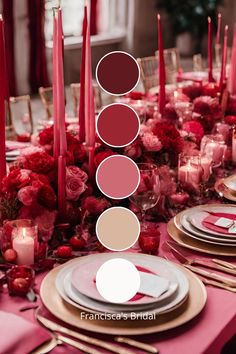 the table is set with pink and red flowers, candles, and place settings for dinner