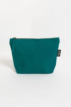 If you’ve been looking for an eco-friendly makeup bag to tame and organize cosmetic items, consider the simple and affordable Lok Pouch. Made from sustainably grown organic cotton canvas, the Lok Pouch’s dimensions (7" X 9" x 3" ) are large enough to accommodate most cosmetic containers and accessories but small enough to easily toss into a larger tote or pack. It has a 7-inch zippered opening with a long pull and a gusseted bottom panel, so it stands up on the countertop for easy access. Conten Eco Friendly Makeup, Cosmetic Items, Cosmetic Containers, Zippered Pouch, Large Tote, Zipper Pouch, Easy Access, Makeup Bag, Cotton Canvas