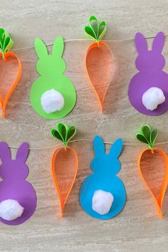 paper carrots with cotton balls in the shape of rabbits