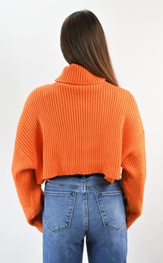 Basic but not boring-a sweater you can live in. This soft ribbed turtleneck sweater is slightly oversized with dropped shoulder sleeves and is cropped at the perfect length. This current wardrobe staple is warm and cozy and looks amazing with any bottoms you choose. Color- Orange (also available in Red and Camel) 50% Viscose 28% Polyester 22% Nylon Trendy Oversized Soft Knit Turtleneck, Trendy High Neck Sweater With Ribbed Cuffs, Trendy Oversized High Neck Turtleneck, Trendy Oversized Knit Turtleneck, Trendy Oversized Turtleneck Sweater, Trendy Oversized Turtleneck With High Neck, Trendy Oversized Spring Turtleneck, Winter High Neck Cropped Sweater With Ribbed Cuffs, High Neck Cropped Sweater With Ribbed Cuffs For Winter