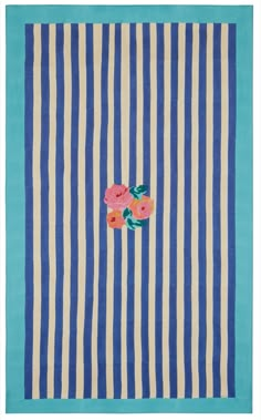 a blue and white striped rug with pink flowers on the front, and green stripes in the back