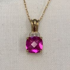 Vintage Estate Diamond and Created Pink 8mm Cushion Sapphire 10K Pendant Pink 14k Stamped Diamond Jewelry, Pink Diamond Jewelry Stamped 14k, Pink Cushion Cut Jewelry With Diamond Accents, Pink Cushion Cut Jewelry Gift, Pink Cushion Cut Diamond Accented Jewelry, Pink Sapphire Necklace For Gift, Pink Sapphire Pendant Necklace As Gift, Pink Sapphire Pendant Jewelry, Luxury Pink Sapphire Diamond-cut Jewelry