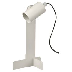 a white lamp with a black cord attached to it