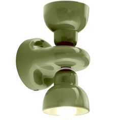 a green light that is on the side of a wall mounted fixture with a white background