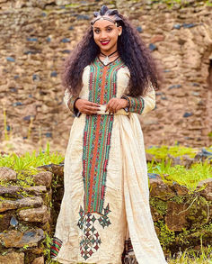 Embrace the beauty of Ethiopian heritage with this stunning traditional dress. Featuring elegant patterns and a flowing design, it captures the essence of cultural pride and grace. Perfect for any special occasion, this dress exudes timeless beauty and sophistication Traditional Long Sleeve Maxi Dress For Festivals, Traditional Maxi Dress With Traditional Patterns, Long Traditional Dresses With Patterns, Traditional Pattern Maxi Dress For Ceremonies, Traditional Ceremonies Maxi Dress With Traditional Patterns, Traditional Long Maxi Dress For Ceremonies, Long Dresses With Traditional Patterns For Ceremonies, Traditional Long Sleeve Dresses For Ceremonies, Traditional Multicolor Long Sleeve Maxi Dress