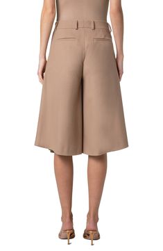 Front pleats release to flare the legs and bring swing to the silhouette of these knee-length culottes unexpectedly tailored from wool flannel. Zip fly with hook-and-bar closure Front zip-slant pockets; back welt pockets 100% virgin wool Dry clean Made in Romania Designer Clothing Chic A-line Wool Bottoms, Beige Knee-length Shorts For Work, Elegant Short Bottoms With Box Pleat, Chic Tailored Knee-length Bottoms, Chic Knee-length Tailored Bottoms, Chic Brown A-line Bottoms, Beige Wool Bottoms For Spring, Spring Wool Beige Bottoms, Spring Beige Wool Bottoms