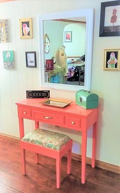 an orange desk with a mirror on the wall