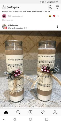 two candles with sheet music on them are sitting on the counter next to each other