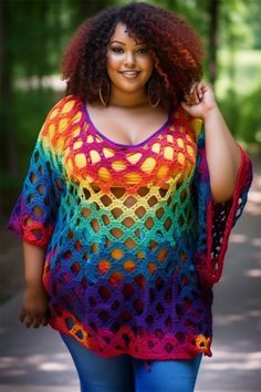 a woman wearing a colorful crochet top and blue jeans