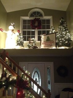 christmas decorations on the top of a staircase