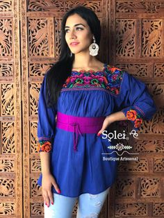 This Beautiful Mexican blouse is embroidered by Cross Stitch and has colorful florals embroidered around the collar. Please note: This blouse comes in one size which fits sizes Small, Medium and Large. You have the option of purchasing the blouse with the belt for a special price or the blouse on its own. The Jewelry modeled may be purchased separately in another post. Multicolor Bohemian Embroidered Long Sleeve Top, Bohemian Multicolor Embroidered Long Sleeve Top, Multicolor Long Sleeve Bohemian Embroidered Top, Embroidered Bohemian Purple Blouse, Multicolor Long Sleeve Peasant Top With Floral Embroidery, Bohemian Embroidered Purple Blouse, Purple Embroidered Bohemian Blouse, Bohemian Purple Embroidered Blouse, Bohemian Purple Blouse With Floral Embroidery