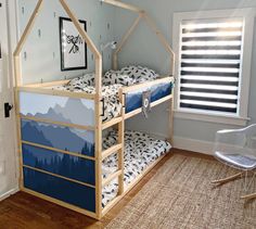 a child's bedroom with two bunk beds and a chair in the corner next to it