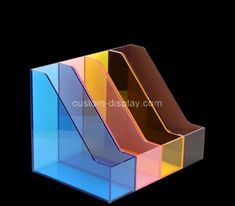 three different colored acrylic boxes stacked on top of each other