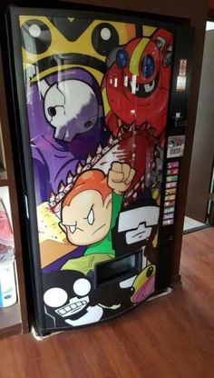 a vending machine sitting on top of a hard wood floor next to a wall