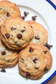 chocolate chip cookies on a white plate with sprinkles