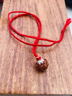 Welcome, Namaste  100% Genuine & Premium Collector Quality Rudraksha 100% Original & Authentic Mahadeva Shiva 8 Mukhi (Ashtamukhi in Sanskrit) Rudraksha Necklace The necklace has - 8 mukhi - Origin - Indonesia Eight Mukhi Rudraksha Represents Lord Ganesha- remover of obstacles and for new beginnings.  Ruling planet - Ketu  Mantra - Om Hum Namah All our Spiritual Products Are Spiritually activated With Mantras & Puja's also known as Abhisheka by our Panditji Priest without any extra charges. Adjustable Spiritual Jewelry For Diwali, Adjustable Necklace For Diwali Gift, Adjustable Necklaces For Diwali Gift, Amulet Jewelry For Puja And Festivals, Amulet Jewelry For Diwali Puja, Diwali Amulet Jewelry For Puja, Amulet Style Jewelry For Puja And Festivals, Spiritual Round Pendant Necklace For Diwali, Diwali Puja Amulet Jewelry