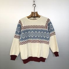 Beautiful vintage nordic knitwear. Ivory white with grayish blue and burgundy geometric pattern. Winter colours for sure. MATERIALS & CONDITION Material is probably mixed wool and acrylic (no label) -- very soft  Condition is : very good vintage condition MEASUREMENTS Size is S (refer to measurements) Do not hesitate to DM if you have any questions ! Armpit to armpit : 55cm / 21,75in Sleeve (collar seam to bottom) : 59cm / 23,25in Front length (collar to bottom) : 58cm /22,75in Back length : 61c Cream Wool Sweater With Fair Isle Pattern, Cream Nordic Sweater With Fair Isle Pattern, White Scandinavian Style Sweater For Fall, White Scandinavian Sweater For Fall, White Scandinavian Style Fall Sweater, Nordic Style White Sweater With Fair Isle Pattern, White Nordic Sweater With Fair Isle Pattern, Vintage Cream Sweater With Fair Isle Pattern, White Fair Isle Sweater For Cold Weather