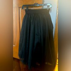 Nwot, Never Worn Tulle Black Midi Skirt. Size Small. Volume Skirt, Several Tulle Layers. Night Out Tulle Midi Skirt, Flowy Tulle Skirt For Night Out, Black Tulle Bottoms For Night Out, Black Flared Tulle Skirt, Black Tulle Flared Skirt, Black Party Maxi Skirt With Gathered Detail, Party Black Gathered Maxi Skirt, Black Mini Tulle Skirt, Black Gathered Maxi Skirt For Parties