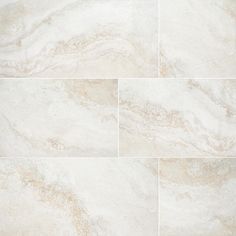 a white marble tile floor with different patterns