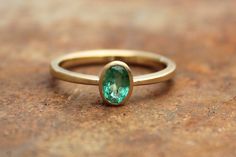 18k Ring With Emerald | Etsy Elegant Green Emerald Ring With Bezel Setting, Minimalist Emerald Ring For Formal Occasions, Minimalist Oval Green Emerald Ring, Minimalist Green Oval Emerald Ring, Modern Green Emerald Promise Ring, Gold Rings For Women, Ring With Emerald, Single Stone Ring, Solitaire Rings