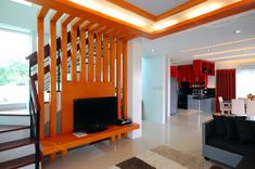 a living room filled with furniture and a flat screen tv