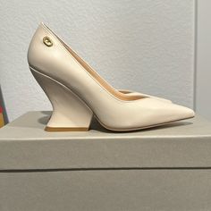 Dee Ocleppo Nappa Leather Ivory Wedge Pumps, Size 6, New, Never Worn, Leather Upper, Interior And Sole, 3,5” Wedge Heel, Made In Italy, Fits True To Size, Pointed Toe But Not Narrow, Comfortable, Box And Dust Bag Included. Cream High Heel Calf Leather Heels, Cream Calf Leather High Heels, Beige Wedge Heels With 4-inch Heel, Luxury Cream Platform Heels, Modern Calf Leather Wedge Heels, Luxury Low Heel Cream Heels, Luxury Cream Low Heel Shoes, Luxury Cream Low Heel Heels, Elegant Leather Wedge Heels