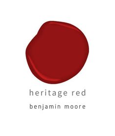 a red circle with the words heritage red on it