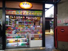 a store front with an assortment of drinks on display