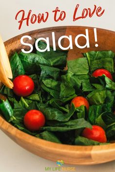 a wooden bowl filled with spinach and cherry tomatoes, text reads how to love salad