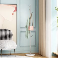 a living room with blue walls and a white chair next to a coat rack in the corner