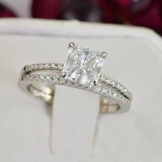 an engagement ring set with a princess cut diamond