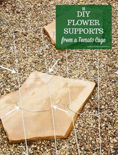 a sign that says diy flower supports from a tomato cage on top of gravel