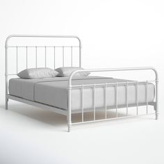 a white metal bed frame with two pillows on the top and bottom, against a white background