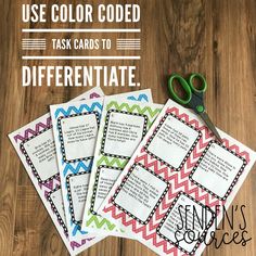 four task cards with scissors on top of them and the words use color code to guide different tasks