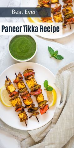 the best ever paneer tikka recipe on a white plate with lemon wedges